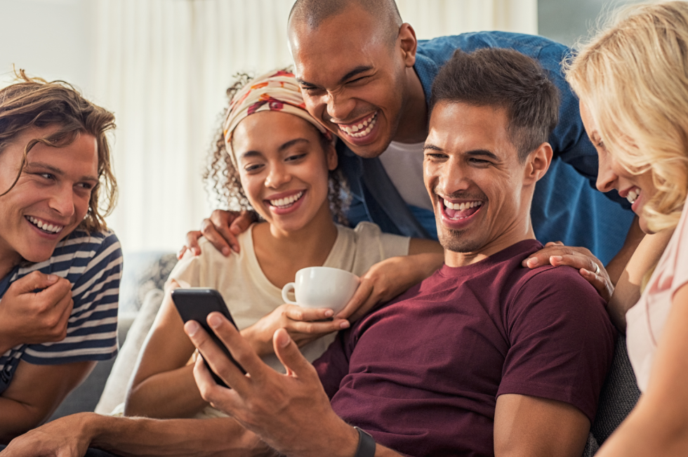 Friends reviewing payment options on a phone