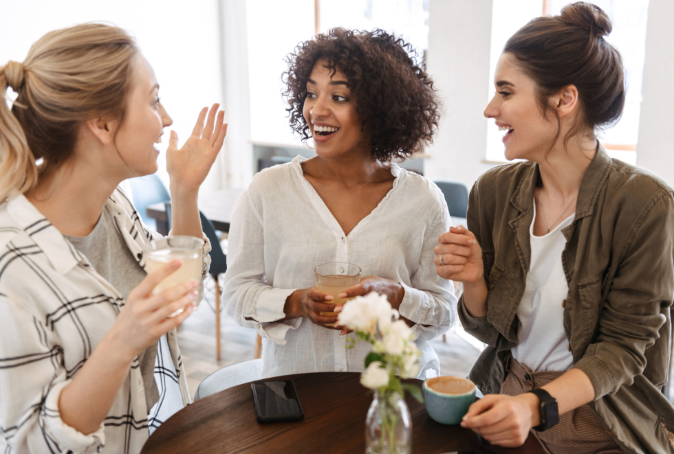 Woman sharing a referral with two friends
